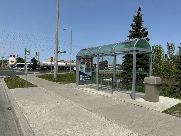 A Durham Region Transit bus shelter with concrete pad in front for accessibility